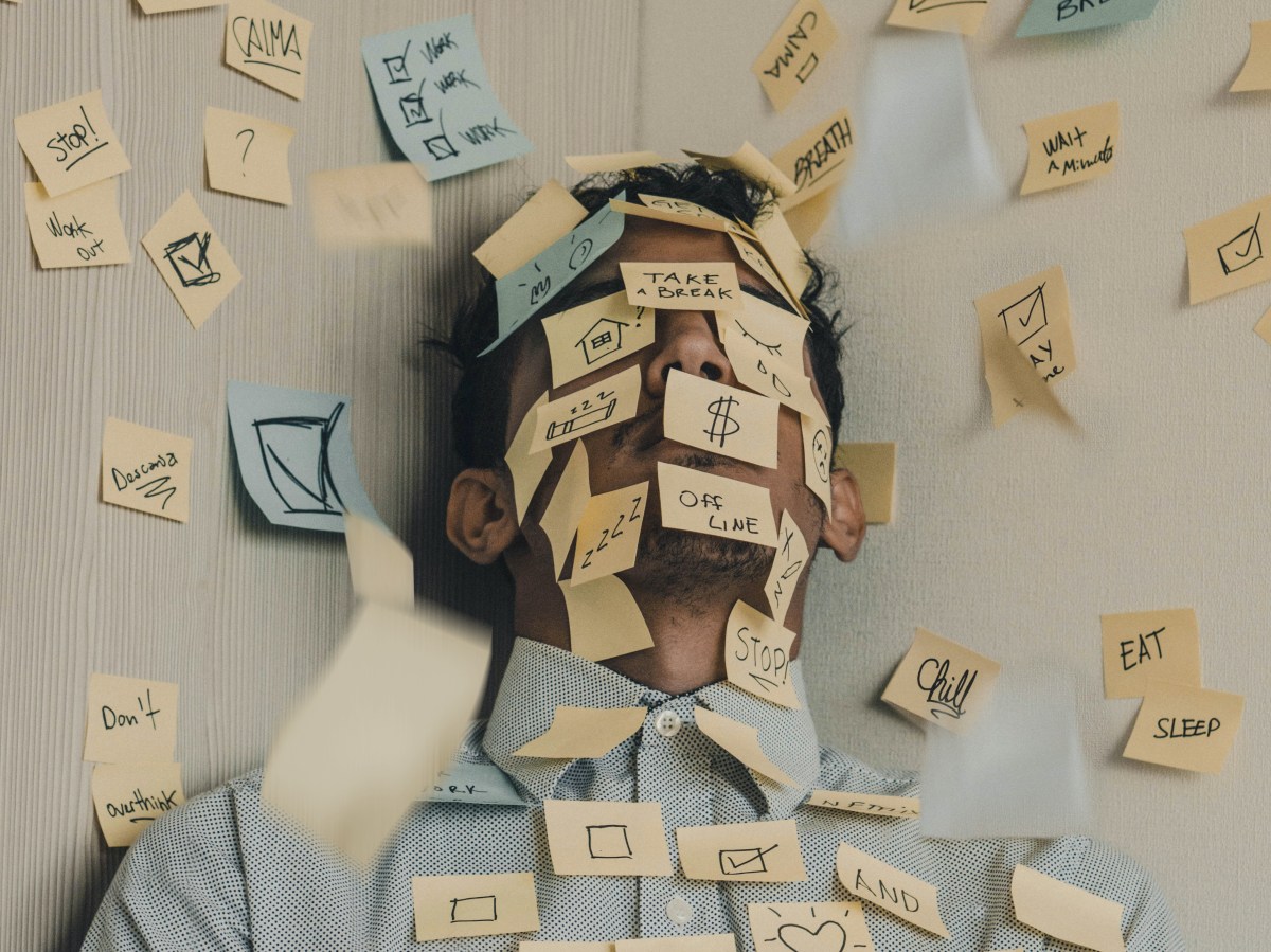 Man covered in post-it notes