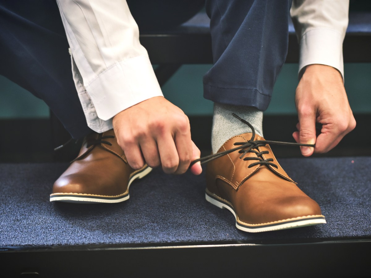 Man tying shoes