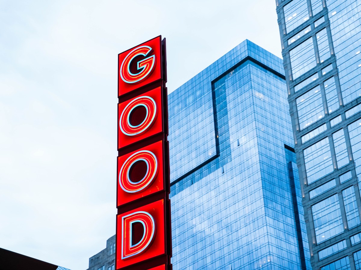Red letters spelling out GOOD in a city landscape